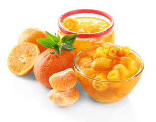 Fototapeta na wymiar Orange jam with zest and tangerines, isolated on white