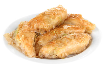 Sweet baklava on plate isolated on white