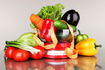Fresh vegetables in scales on gray background © Africa Studio