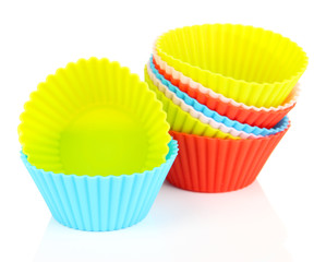 Stack of colorful cupcake cases isolated on white