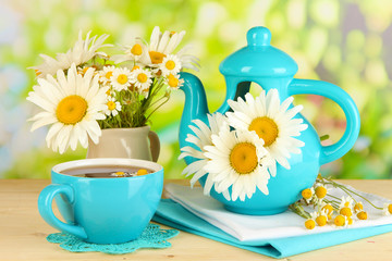 Beautiful bouquet chamomiles in teapot