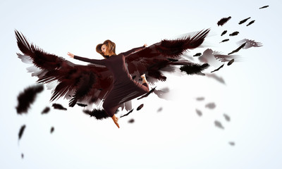 Woman floating   on dark wings