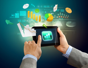 Close-up of hands holding tablet pc
