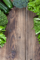 Directly above view of raw vegetables on wooden table.