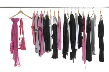 fashion female clothing hanging on hangers