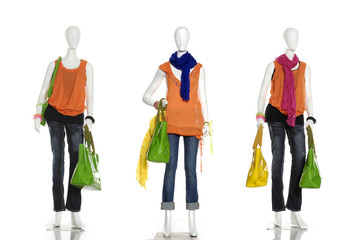 Obraz premium fashion dress with handbag and scarf on female three mannequin