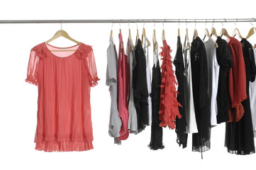 Set of fashion female clothing hanging on hangers