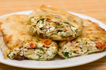 Pita bread wrapped with cottage cheese and vegetables