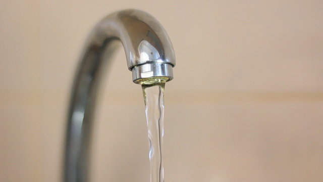 water flows from the tap