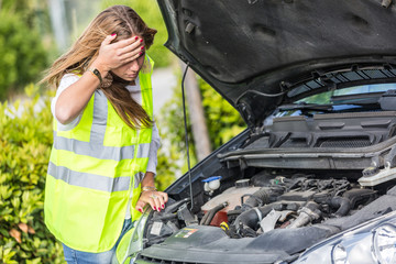 Young Woman with Damaged Car