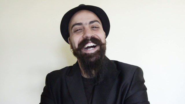 satisfied happy bearded man with hat