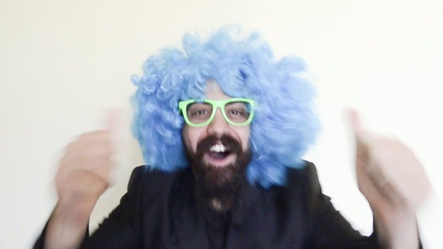 funny bearded man with blue wig singing