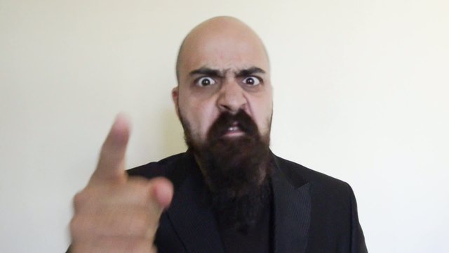 menacing bearded man angry