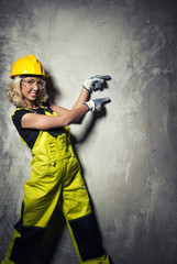Attractive builder woman showing something with the hands