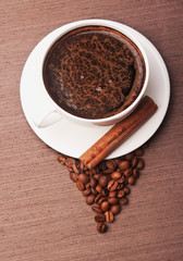 Coffee cup on wooden background
