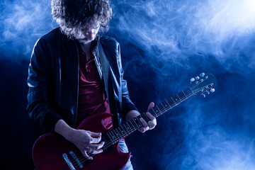 Young Man Playing Electric Guitar
