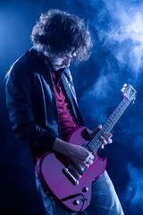 Young Man Playing Electric Guitar