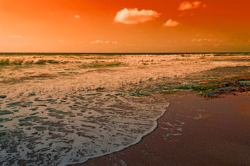 waves on the foreshore at dusk