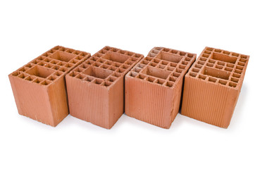 Stack of clay bricks isolated on white