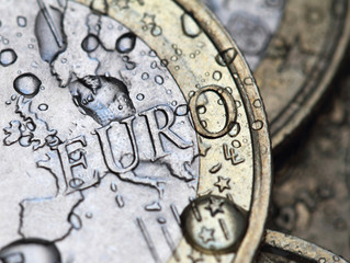 euro coin detail with rain drops