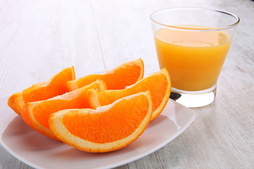 Juice glass and orange fruit