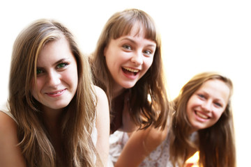 Beautiful girls smiling on white background