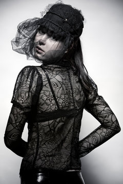 Junge Frau mit Lack-Minirock und Haute Couture Spitzentop Stock Photo |  Adobe Stock