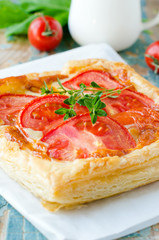 Pie with tomatoes and cheese . Selective focus