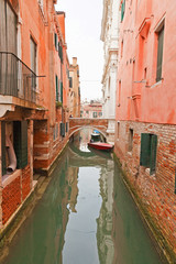 Fototapeta na wymiar Canal with houses, bridge and boats. Venice. Italy.