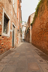 Small street with houses in Venice, Italy.