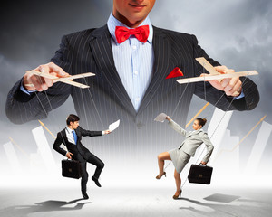 Businessman puppeteer