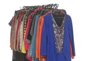 women's clothes hanging on a rack.