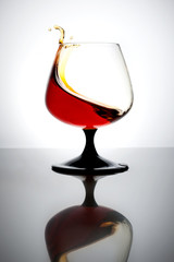 Splash of cognac in glass