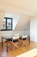 Interior, beautiful loft, hardwood floor, glass dining table