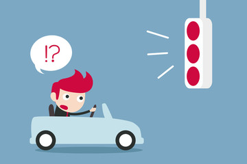 businessman confusing with red traffic light