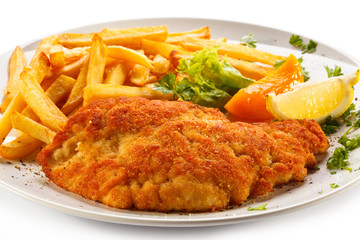Pork chop, French fries and vegetables