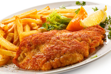 Pork chop, French fries and vegetables