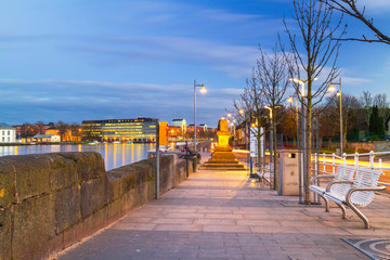 Footpath at Shannon river in Limerick city at night, Ireland