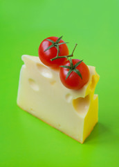 Cheese and tomatoes on green