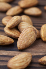 almonds on rustic wooden background