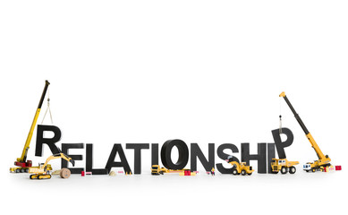 Developing a relationship: Machines building word. - obrazy, fototapety, plakaty