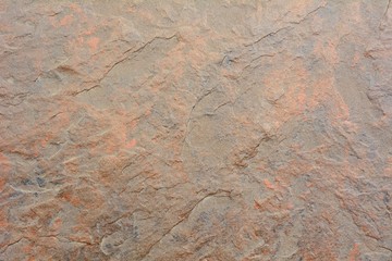 Closeup shot with dark orange tile background.