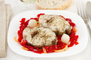 fish with pepper and onion on the plate
