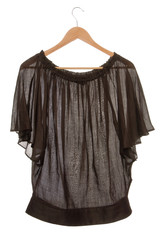 Wide brown blouse is on clothes-hanger.
