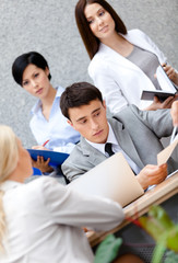 Businessman at the conference with his employees