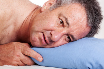 Man lying in bed and can not sleep