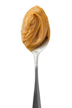 Naklejki Creamy peanut butter in a spoon