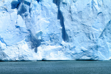 ice falling off of a glacier in Patagonia, South America.