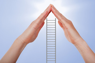 Hands protect ladder