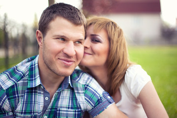 Fototapeta premium Young couple relaxing in park